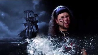 Singer in foreground of a ship on the sea